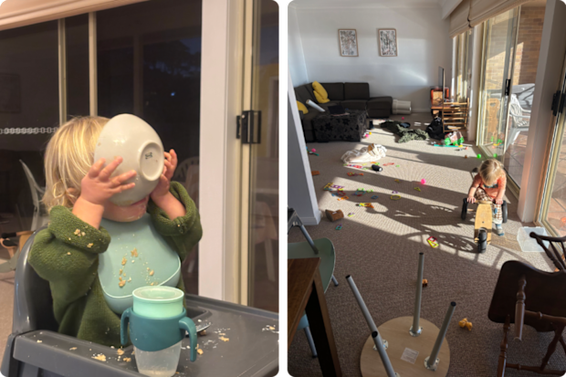A toddler eating messily from a bowl