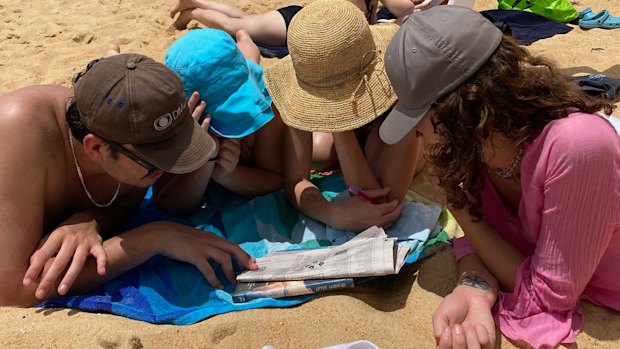 Crosswords on the beach.