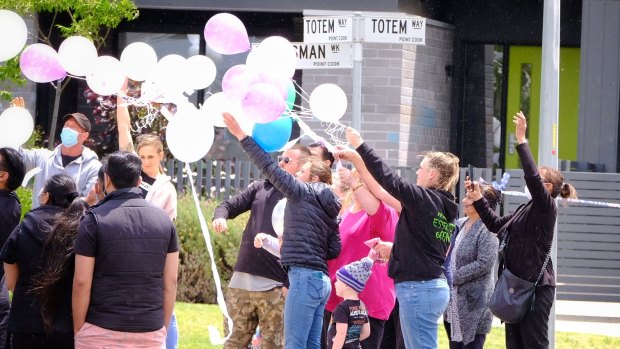 Family, friends and neighbours gathered at a Point Cook park on Sunday to remember Abbey Forrest, her partner Indi Singh and three-week-old daughter Ivy who died in a house fire this week. 
