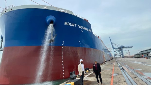 Rashpal Singh Bhatti, BHP commercial executive, supply chains, and Vandita Pant BHP chief commercial officer at Jurong Port Singapore in front of the Mount Tourmaline, the world’s first LNG-powered bulk carrier.