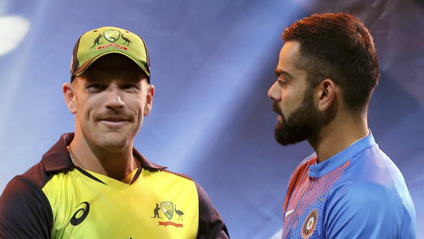 Aaron Finch, left, and Virat Kohli. 