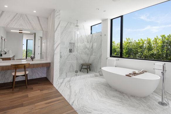 The bathroom includes marble accents.