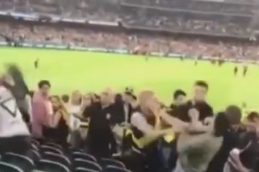 Footage shows  vicious brawl involving at least six at MCG after AFL season opener