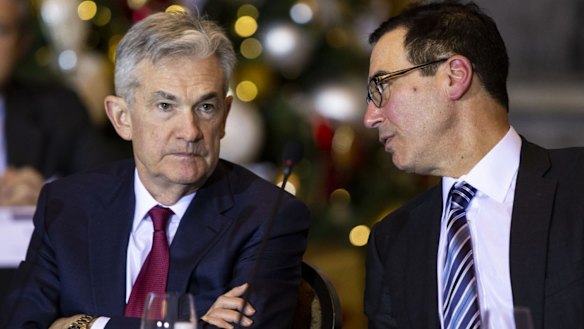 US Treasury secretary Steven Mnuchin, right, speaks with Jerome Powell, chairman of the US Federal Reserve, during a Financial Stability Oversight Council (FSOC) meeting in December.