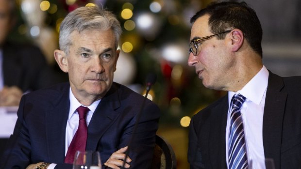 US Treasury secretary Steven Mnuchin, right, speaks with Jerome Powell, chairman of the US Federal Reserve, during a Financial Stability Oversight Council (FSOC) meeting in December.