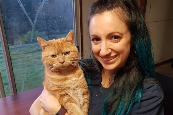 Vet nurse Ashleigh Cattenazzi with Avocado the cat, one of her eight pets.