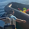 Protest organiser Danny Tommo sought to stop one of the inflatable boats by slashing it with a knife.
