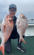 Club secretary Chantal Meehan with two prize catches.