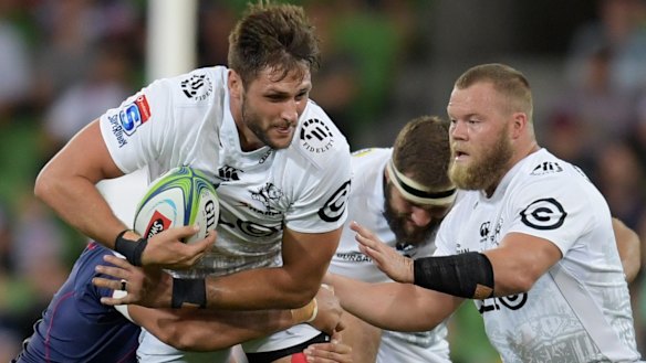 Ruan Botha of the Sharks is tackled during the Round 6 Super Rugby match between the Melbourne Rebels and the Sharks.