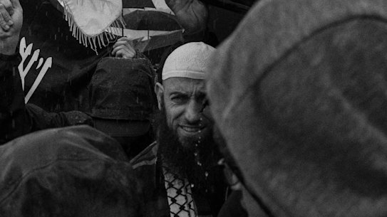 Wisam Haddad, also known as Abu Ousayd, whose ABC Four Corners program has identified as a spiritual leader of Australia’s pro-Islamic State network, at the March for Humanity in August. He was accompanied by about a dozen younger men.