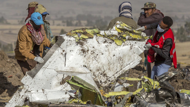 Rescue workers comb the scene of the Ethiopian Airlines crash.