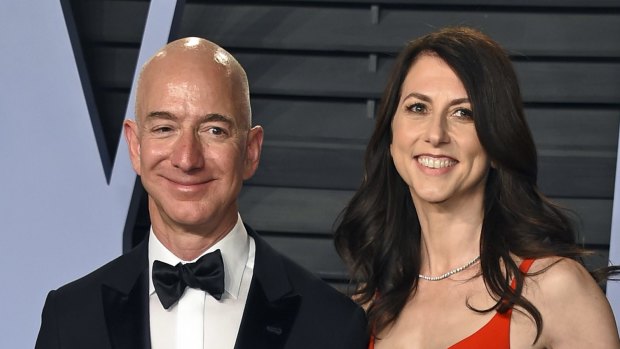 Jeff Bezos and his wife MacKenzie Bezos pictured last year, before the publication of salacious details of his affair.