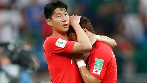 Up against it: Son Heung-min, left, embraces teammates Hwang Hee-chan after their loss to Mexico.