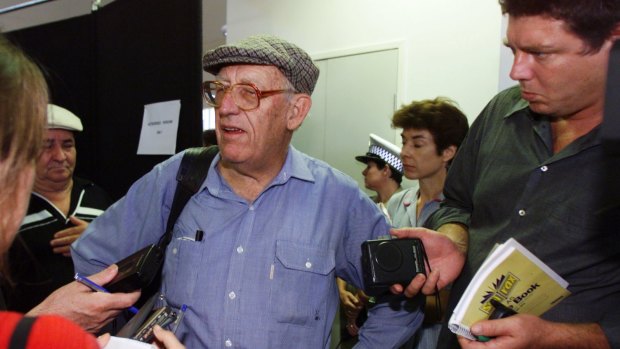 Former Australian consul in East Timor James Dunn arrives back in Australia on the first flight out of Dili in 1999.