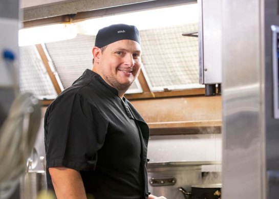 In an online profile, Mitchell Efeimoff published a photo of himself working in a kitchen.