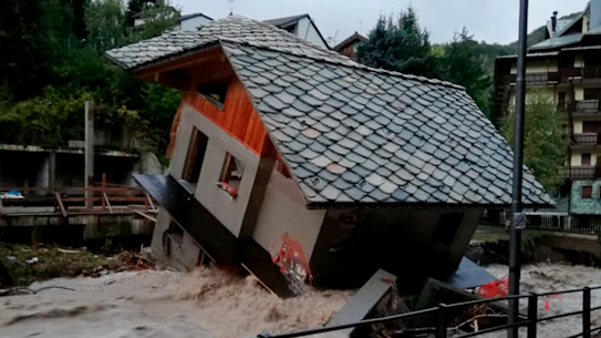 A building is toppled over by the Cervo river in spate due to heavy rains in Biella, northern Italy, on Saturday, October 3. 