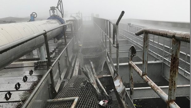 The damage caused by a helicopter crash on the roof of a New York office tower.