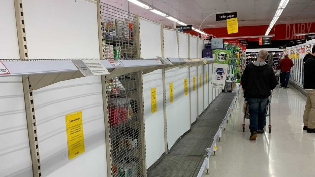 Queues building up and depleted toilet paper shelves at Forestville Coles.