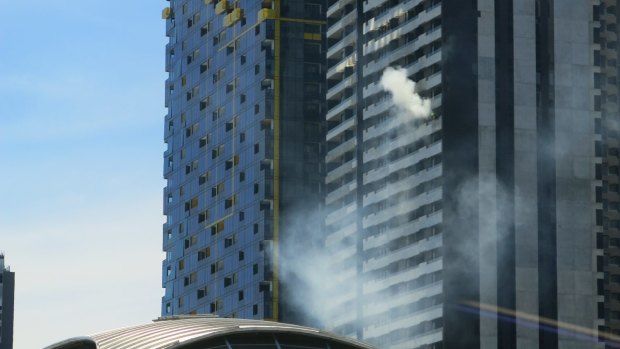 Smoke billowing from the same apartment building in Spencer Street in 2015. 