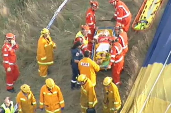 A person is put on a stretcher after the hot air balloon crash in the Yarra Valley on February 8, 2018.