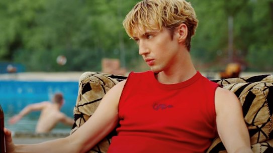 Troye Sivan in a trademark cropped shirt. 