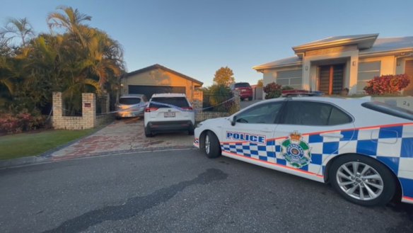 Police at one of the two crime scenes on Sunday.