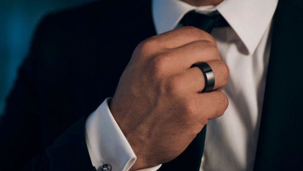 The Motiv smart ring is only a little bigger than the standard male wedding band.