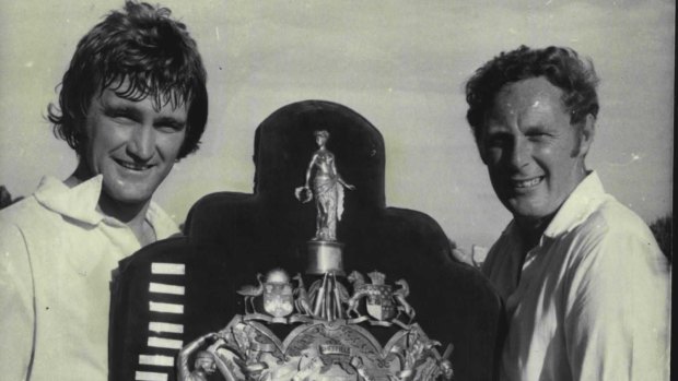 Tasmanian captain Jack Simmons (right) hadn't seen the Sheffield Shield before in 1983, so teammate Dennis Baker shows him at the WACA.