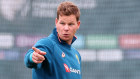 Steve Smith speaks to Alex Carey  during training.