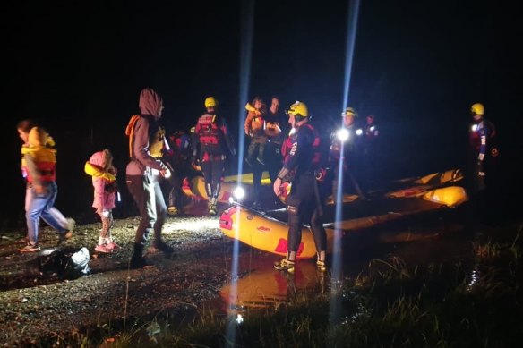 Fire & Rescue NSW crews found snakes in the boats as they rescued a family in Sancrox, NSW.