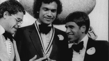 Stephen Michael (centre) in 1981 after winning his second Sandover Medal with a record 37 votes over Phil Narkle (left) and Jim Krakouer (right). 