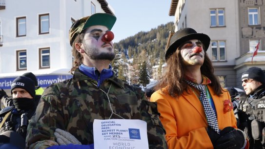 Protesters in clown outfits demonstrate against the World Economic Forum in Davos, Switzerland.