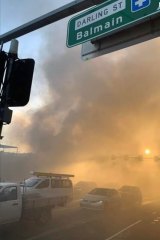 Plumes of smoke rise from the blaze at the former site of Balmain Leagues Club.