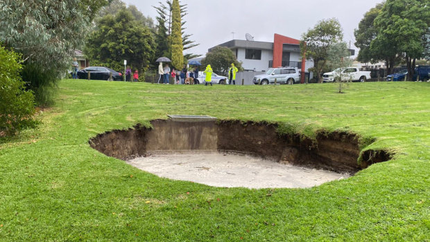 Emergency services are worried the sinkhole will get bigger as rain continues. 