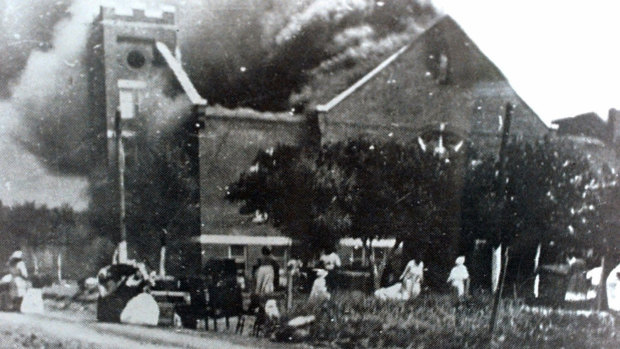 Mt. Zion Baptist Church burns after being torched by white mobs during the 1921 Tulsa massacre. 