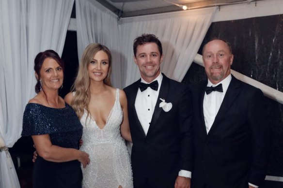 Travis Head with his parents Ann and Simon and wife Jessica.