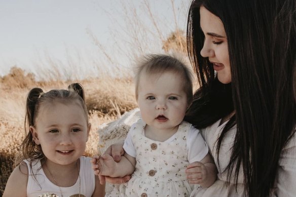 Mother Ellie Smith with Cleo and baby Isla. 