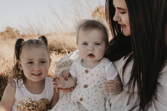 Mother Ellie Smith with Cleo, who is now missing, and baby Isla. 