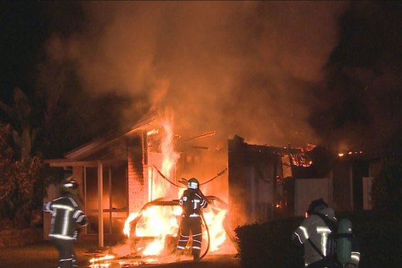 One of the houses goes up in flames.