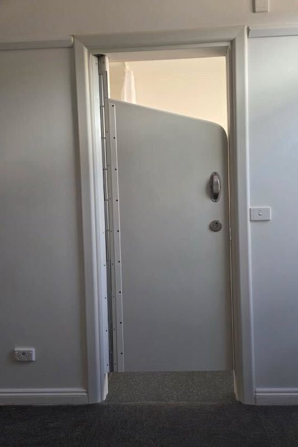 A clinical en suite door from the Swanston Centre in Geelong, which cannot be locked but is all that separates patients in the acute psychiatric ward. 