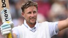 Joe Root of England celebrates reaching his century.