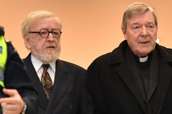 Cardinal Pell, with his lawyer Robert Richter, QC (left), arrives at Melbourne Magistrates Court.