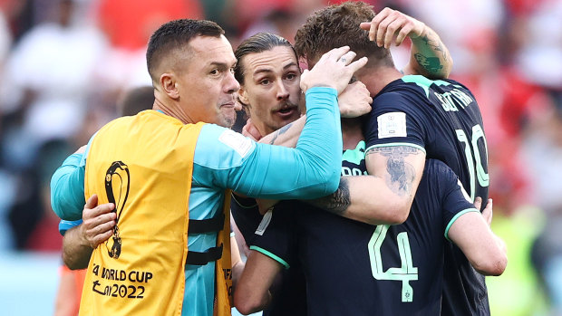 Australia’s players celebrate their win over Tunisia.