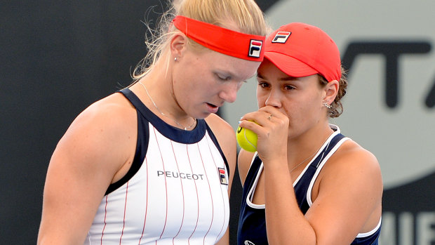 Ashleigh Barty and Kiki Bertens talk tactics in their doubles match against Nicole Melichar of the USA and Yifan Xu of China.