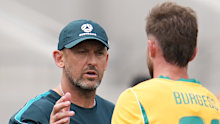 Tony Popovic greets Cameron Burgess after the match.