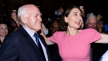 Premier Gladys Berejiklian with former prime minister John Howard at the Sofitel Wentworth after her NSW election victory on Saturday night.
 