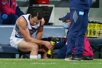 Patrick Dangerfield receives medical treatment in round 21.