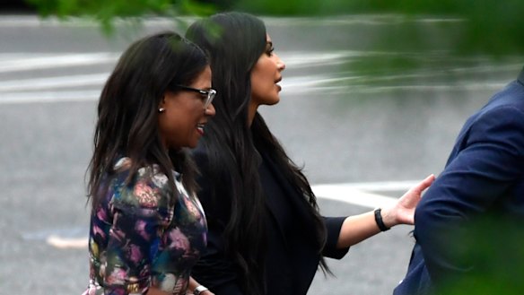 Kim Kardashian, second from left, leaves the West Wing of the White House in Washington on Wednesday.