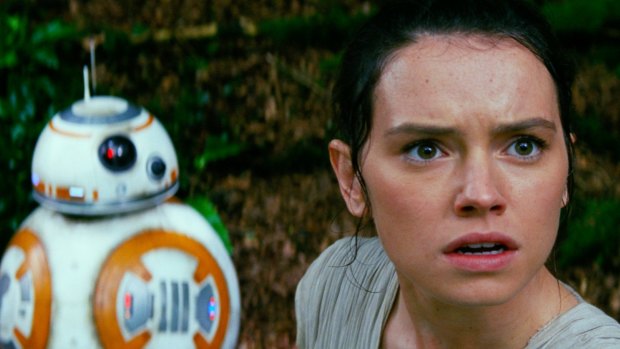 Daisy Ridley, who plays Rey, with the droid BB8- in Star Wars: The Force Awakens.