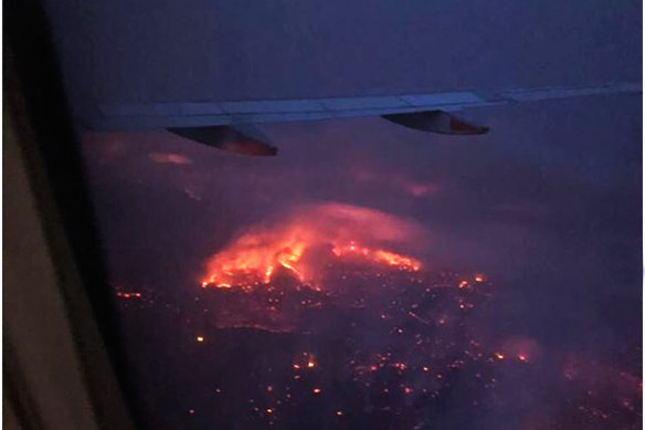 The Adelaide Hills were burning on Friday night as Melissa Ellery's plane flew in.